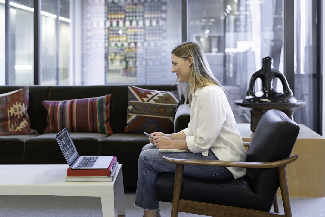 Image of a woman leading a virtual meeting with colleagues, explaining 'What is Sales Bookings' and its significance in business operations.